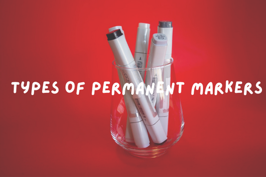 markers placed in a glass with a red background